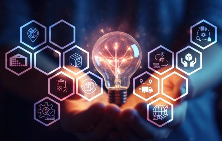 Hands holding lightbulb with logistics chart overlayed